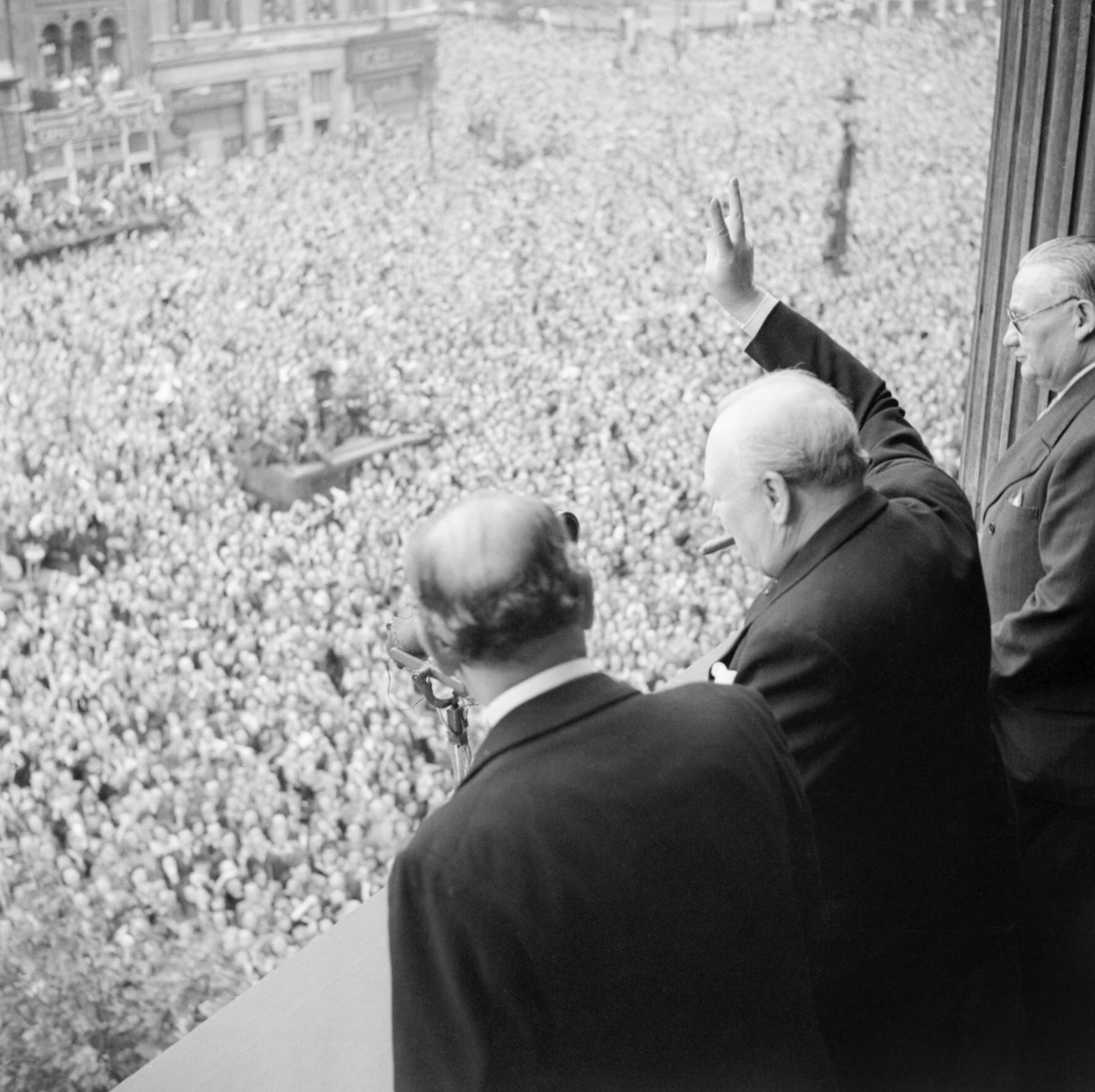 Winston Churchill waves to crowds in Whitehall in London as they celebrate VE Day